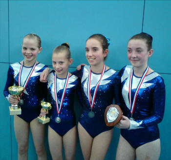 Cooper's Team with trophies and team medals