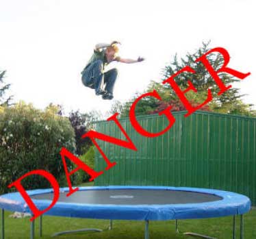 Trampoline safety can only happen if safe practices are followed - image shows child exhibiting a lack of care on a garden trampoline.